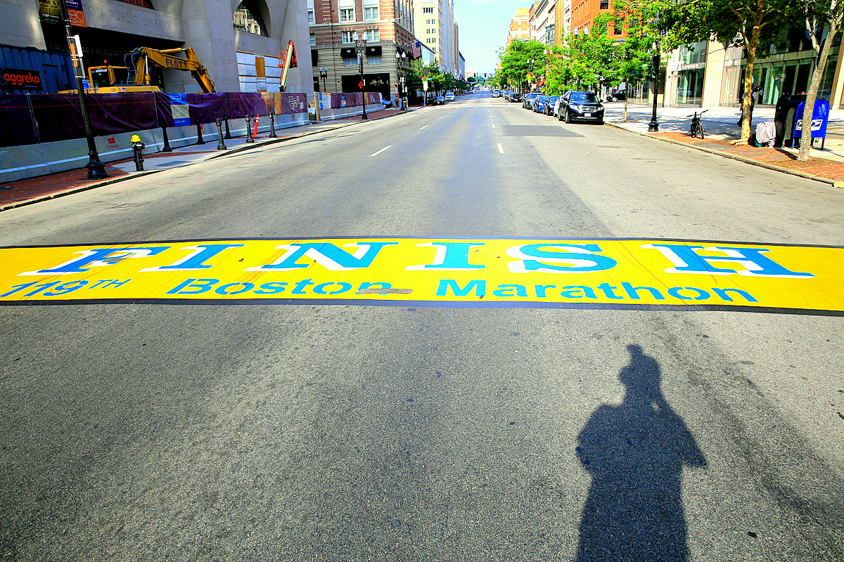 The Boston Marathon finish line painted across Boylston Street