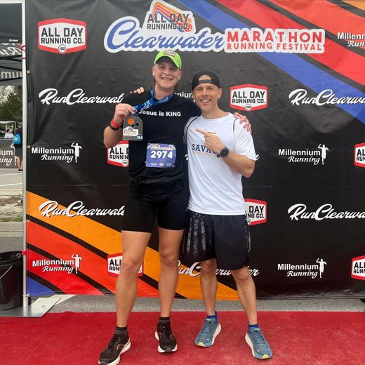 Runners with finisher medals at the Clearwater Half Marathon