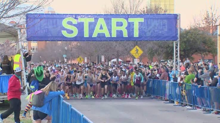 Runners leaving the start line at the Cowtown race weekend in Fort Worth