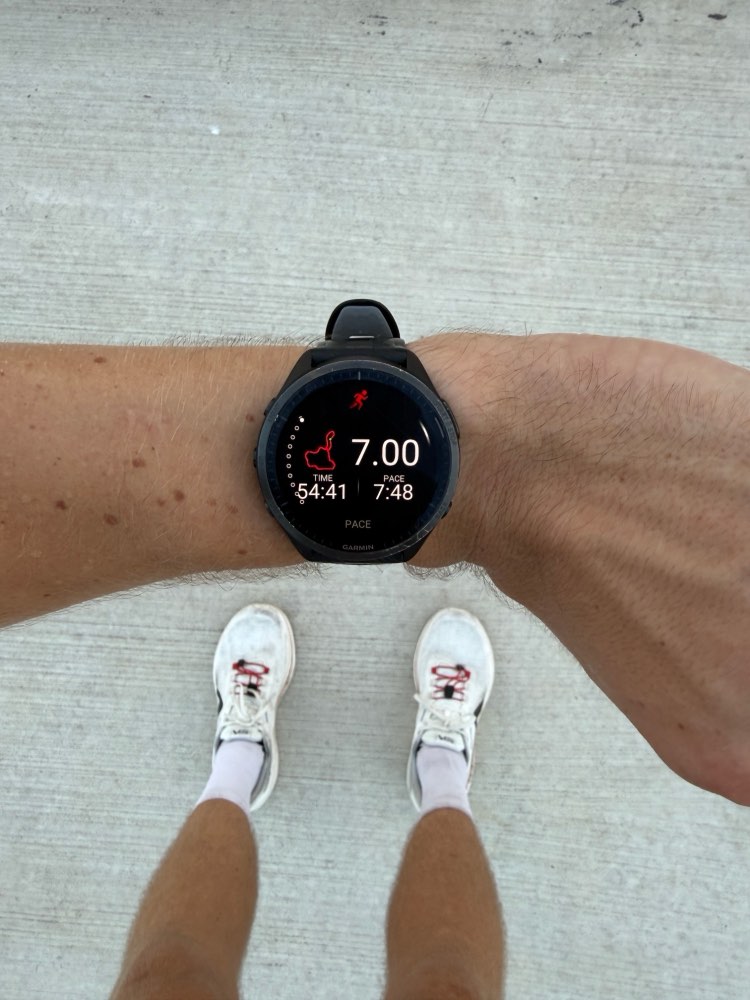 Garmin GPS running watch on a runner's wrist