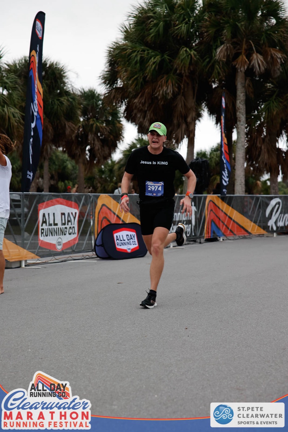 Pierce Showe grimacing as he runs toward the finish of the Clearwater Half Marathon