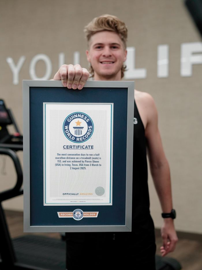 Pierce Showe holding his Guinness World Records certificate