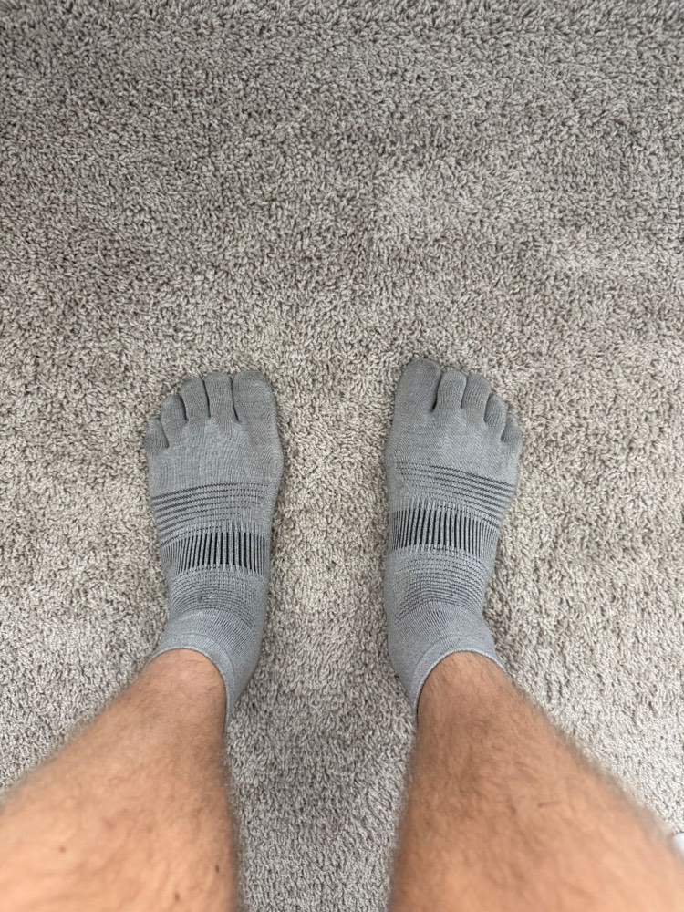Pierce Showe wearing gray Injinji toe socks