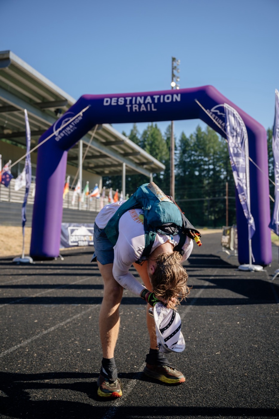 Pierce Showe bent over at the finish line of a 200-mile race